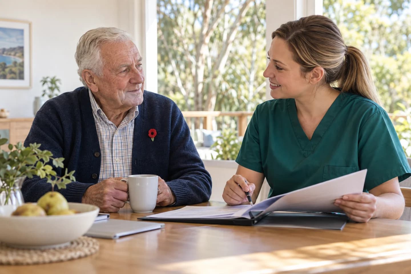Nurse reviewing care notes with an older man wearing a red poppy pin